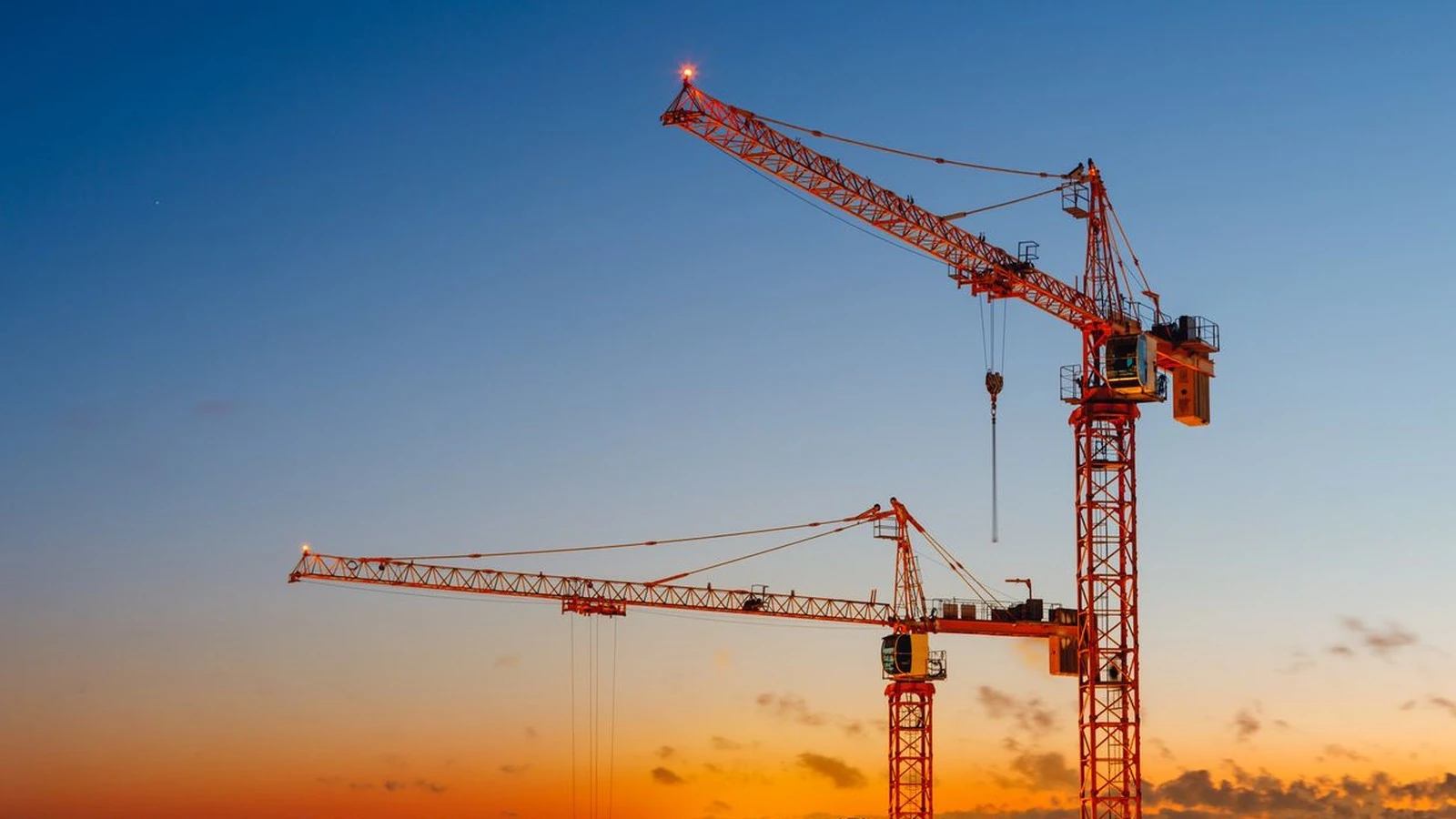 Tower crane on a building project, showing long-duration ownership context